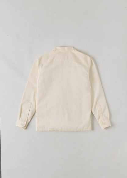 Rear view of a cream coloured button up long sleeve shirt. 